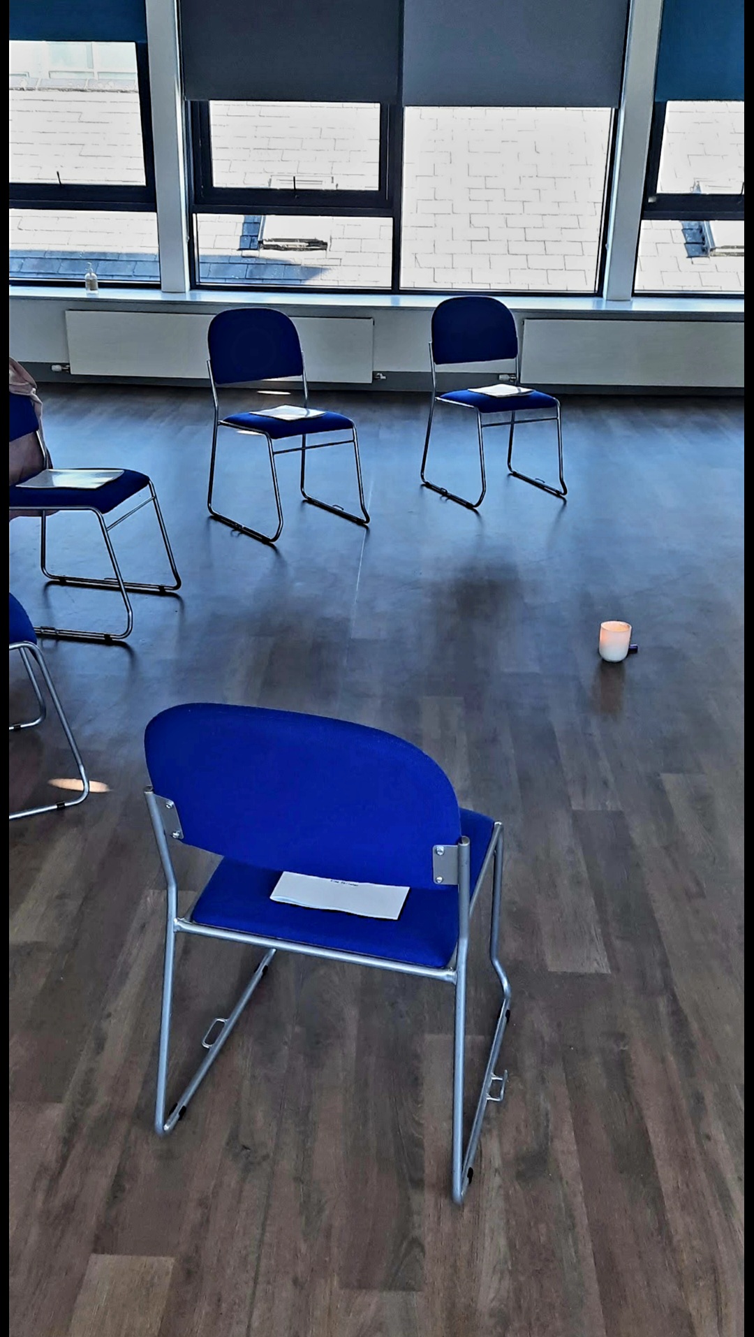 Chairs and cushions set up for a workplace mindfulness session