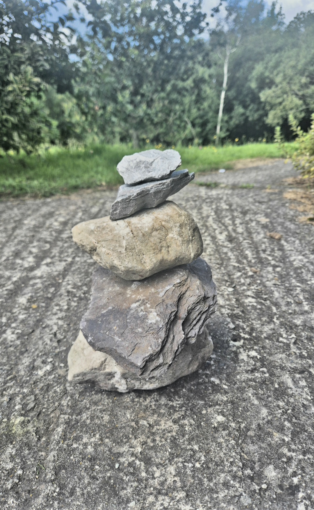 A stacked stone cairn along the retreat grounds