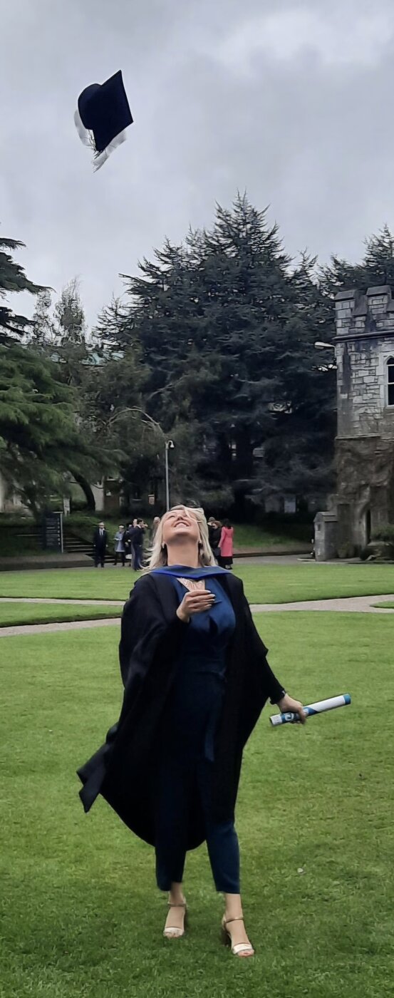 Alma on graduation day, throwing her cap in the air at University College Cork