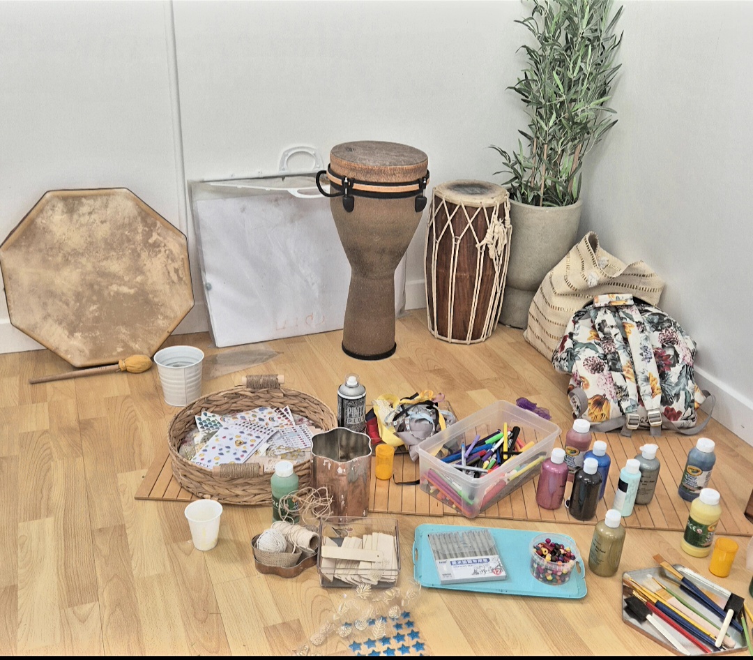 Creative space with instruments and craft materials laid out